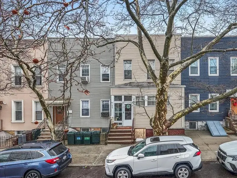 Row of attached homes on 70th Street in Glendale, Queens.