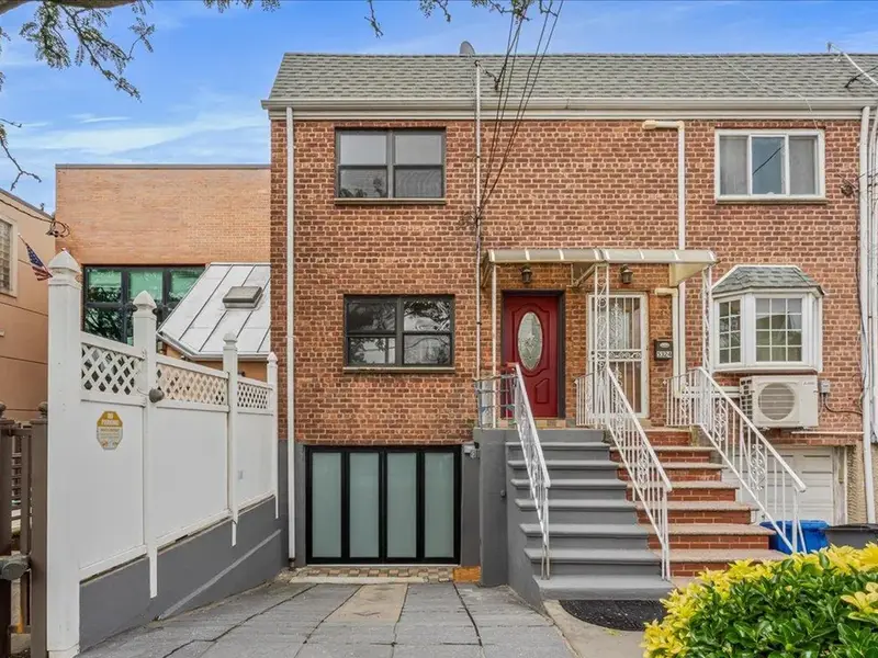 Brick two-story home at 53-26 61st Street in Maspeth, Queens.